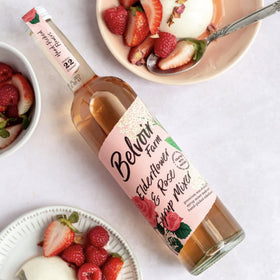 Belvoir Fruit Farms Elderflower & Rose Syrup ingredients close-up showcasing real elderflowers and rose extracts.