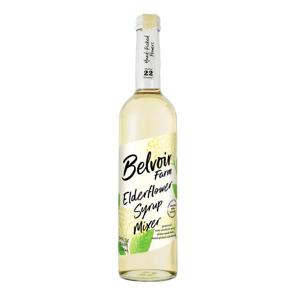 Belvoir Fruit Farms Elderflower Syrup bottle with fresh elderflowers for premium cocktails.