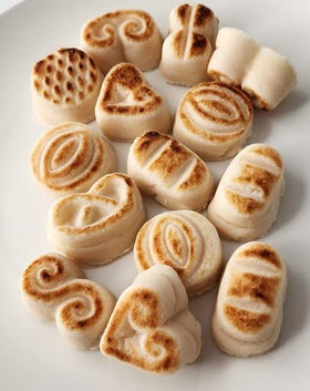 Bergen Marzipan Toasted Marzipan slices arranged on a plate for a refined nibble with nutty aroma.