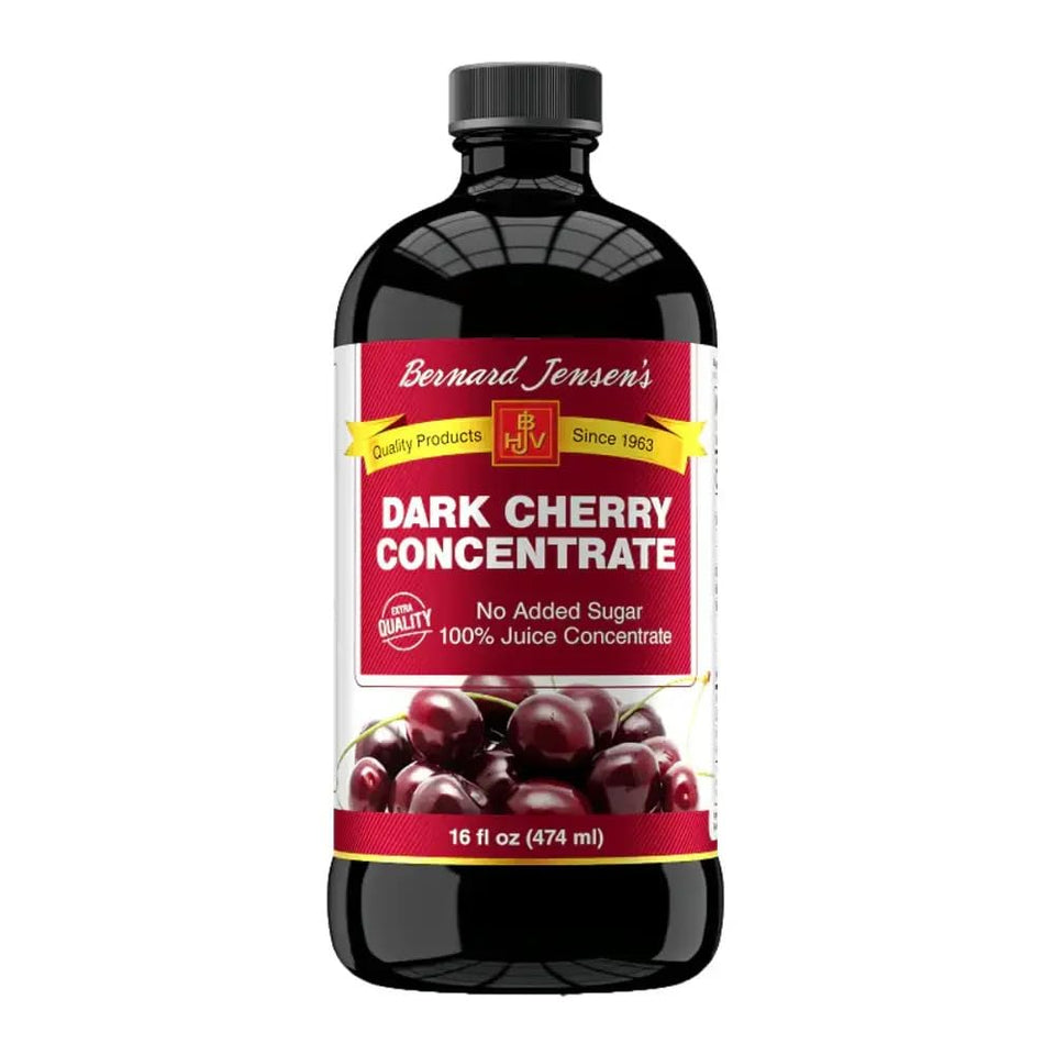 Bernard Jensen's dark cherry concentrate bottle pour, ideal for desserts and drinks.