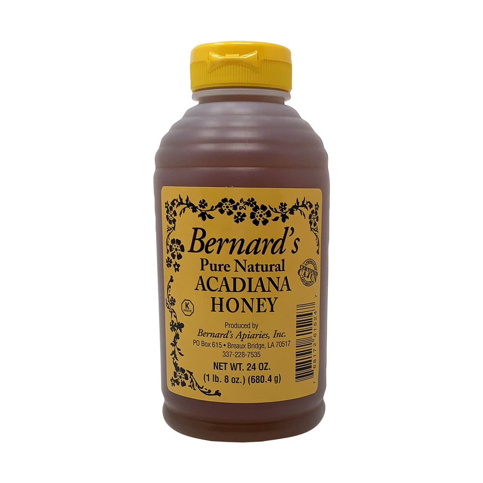 Bernards Apiaries Acadiana Honey bottle with golden drizzle for tea and toast.