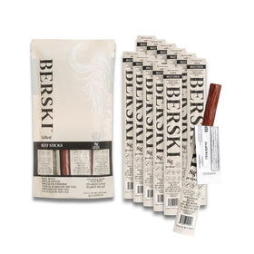 BERSKI Salted Beef Sticks on a wood board showcase a convenient workout and travel snack.