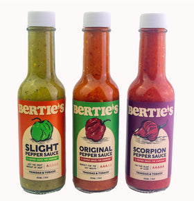 Bertie's Original bottle shows vibrant yellow Scotch Bonnet peppers for bold flavor