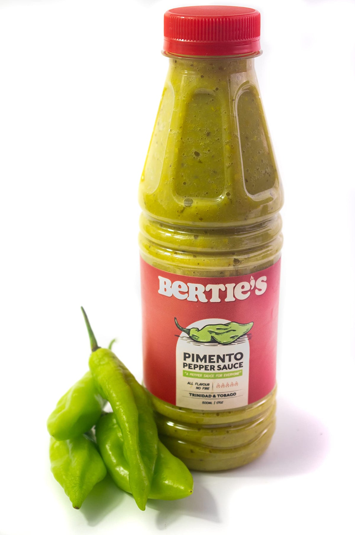 Bertie's Trinidad Pimento Sauce bottle on kitchen counter for rich, heat-free flavor