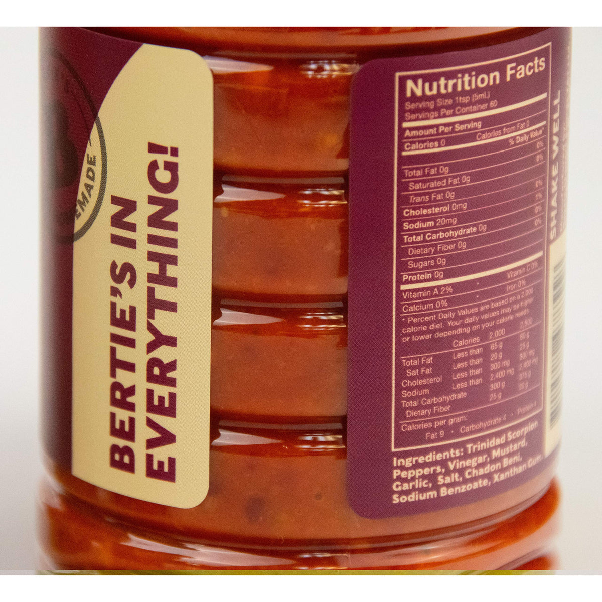 Bertie's Trinidad Scorpion ingredients graphic shows peppers, vinegar, and spices for heat.
