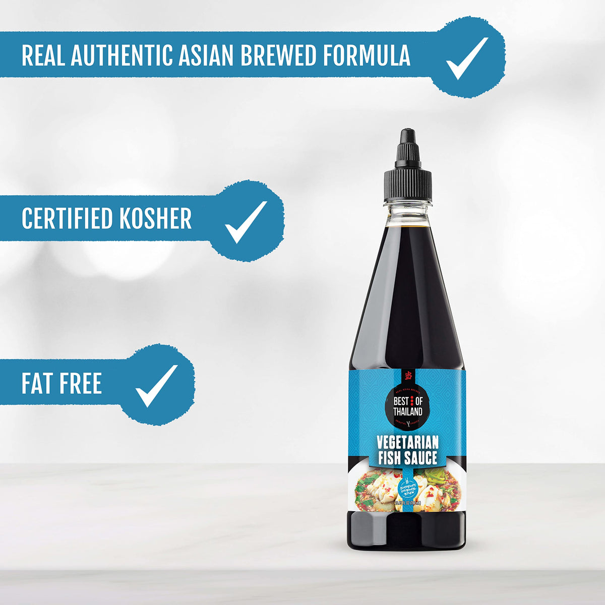 Pouring Best of Thailand vegan fish sauce into a pan.