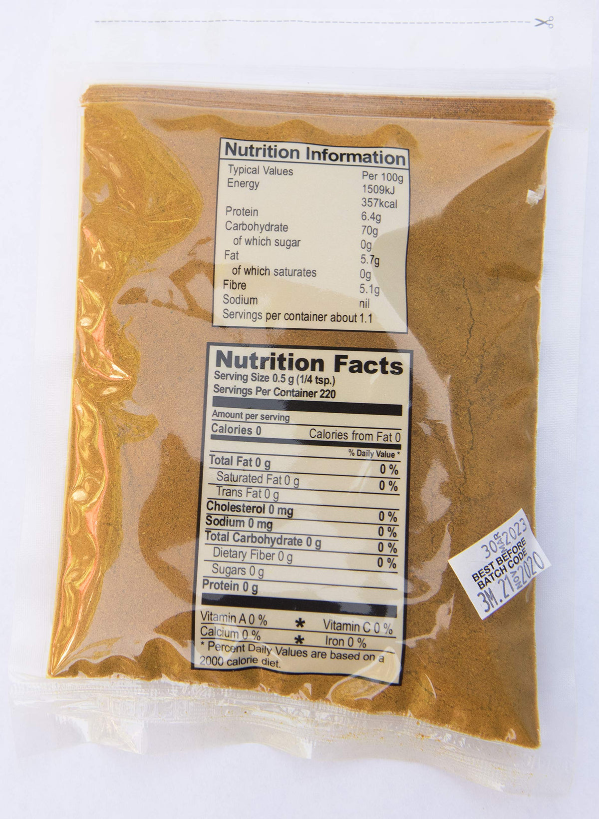 Betapac curry powder jar closeup shows aroma for authentic Jamaican dishes.