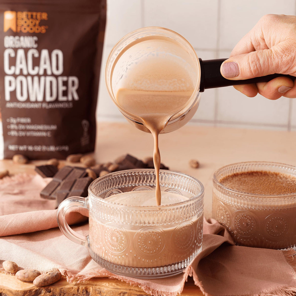 BetterBody Foods Organic Cacao Powder being added to batter for rich flavor