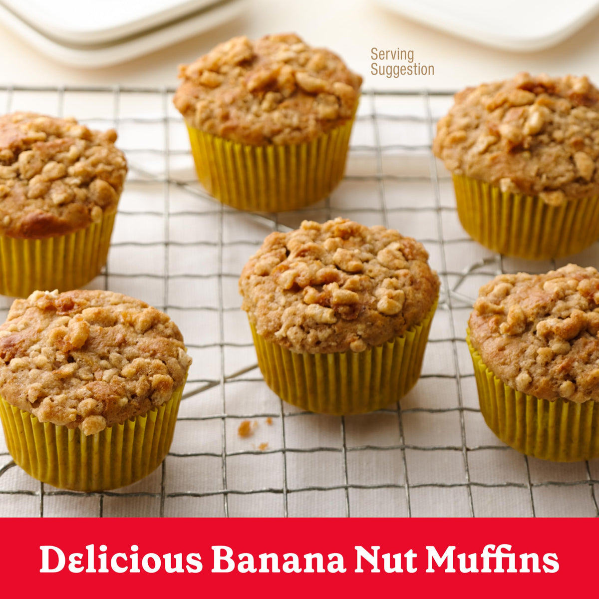 Fresh muffins cooling on a rack with banana aroma.