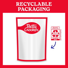 Pack of Betty Crocker mix on a tidy pantry shelf.