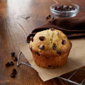 Betty Crocker chocolate chip muffin mix being poured into a bowl to mix.