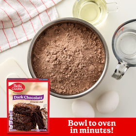 Measuring ingredients for Betty Crocker brownie mix before baking
