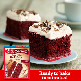 Batter is poured from Betty Crocker Delights red velvet cake mix for even baking.