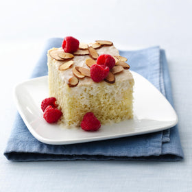 Mixing Betty Crocker vanilla cake mix with eggs and oil for a moist cake