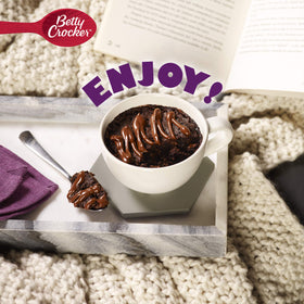 Betty Crocker Mug Treats dry mix measured for quick microwave dessert.
