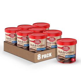 Betty Crocker Rich and Creamy Milk Chocolate Frosting tub ready to spread on a cake