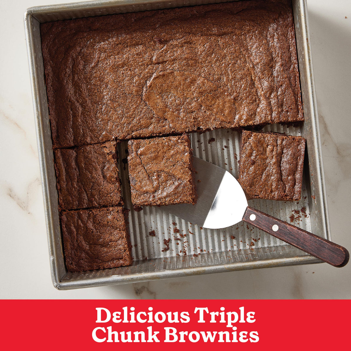 Betty Crocker Supreme Triple Chunk Brownie Mix close-up of chocolate chips and chunks for rich brownies.