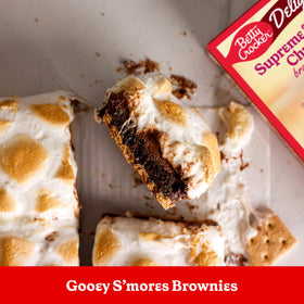 Served brownie slice showing fudgy texture and glossy surface.