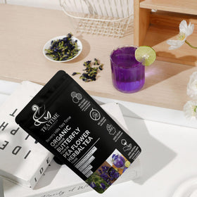Beverly Hills Tea Time brewed butterfly pea tea pour shows vivid blue-to-purple transition with a splash of citrus.