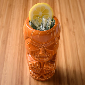 BG Reynolds Orgeat with orange garnish beside glass