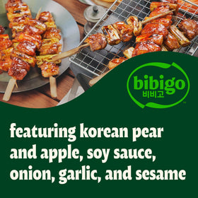 Close-up of Bibigo ingredients: soy, onion, garlic, apple, pear, sesame for depth.