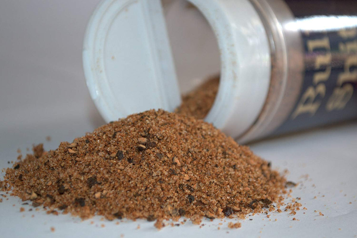 Big Cock Ranch Bullshit steak seasoning in kitchen scene adds bold flavor potential.