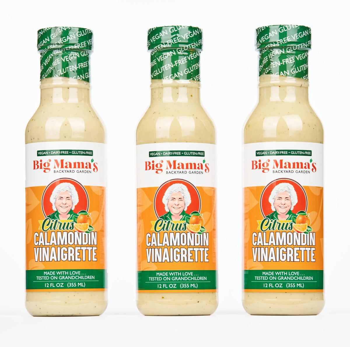 Big Mama's Citrus Calamondin Vinaigrette bottle pouring tangy brightness onto salads
