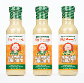 Big Mama's Citrus Calamondin Vinaigrette bottle pouring tangy brightness onto salads