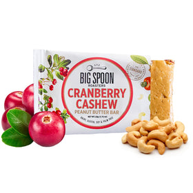 Big Spoon Roasters Cranberry Cashew Nut Butter Bars texture close-up highlights creamy yet crunchy bite for snacking.