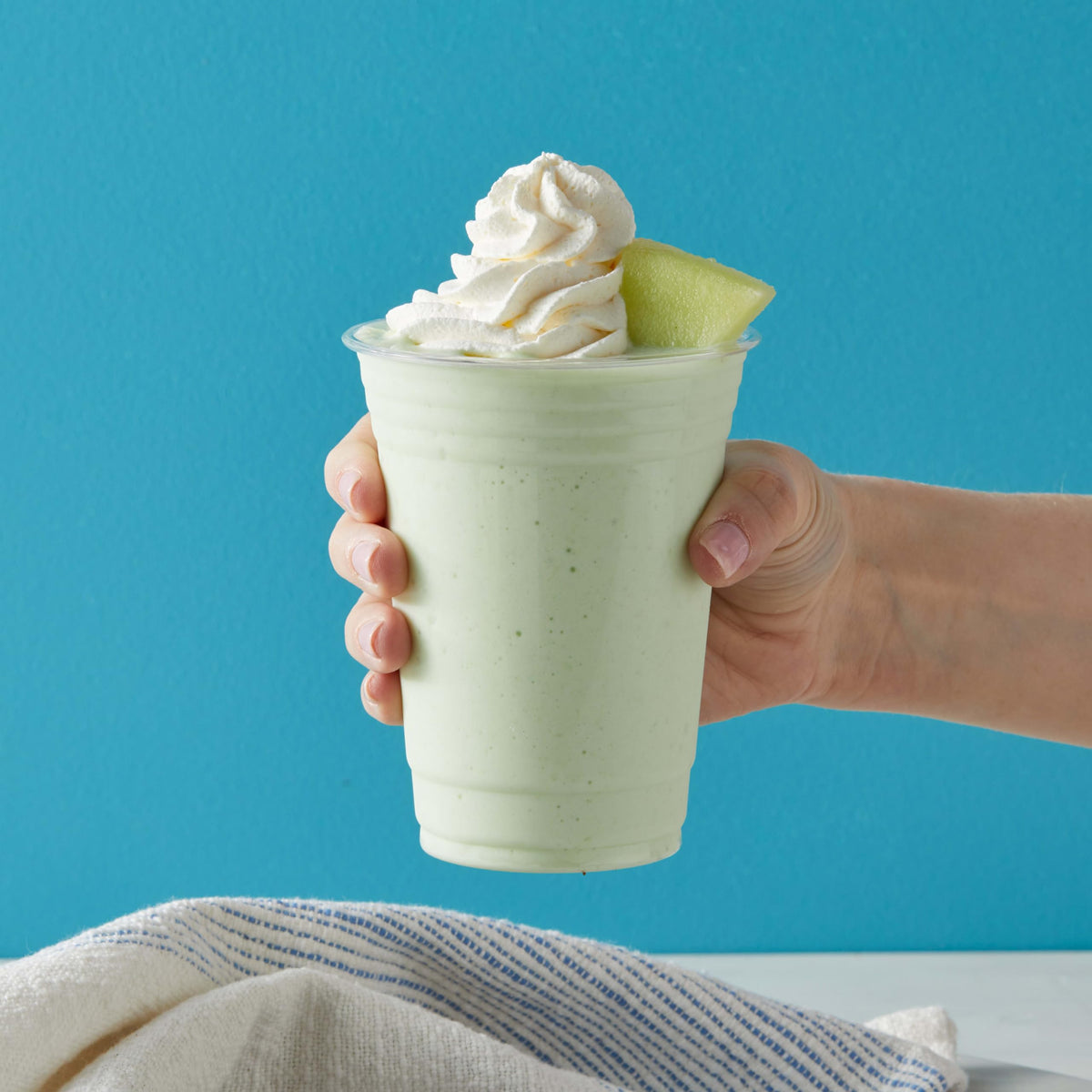 Big Train Dragonfly Honeydew Blended Crème Frappe whipped-cream topping adds indulgent texture.