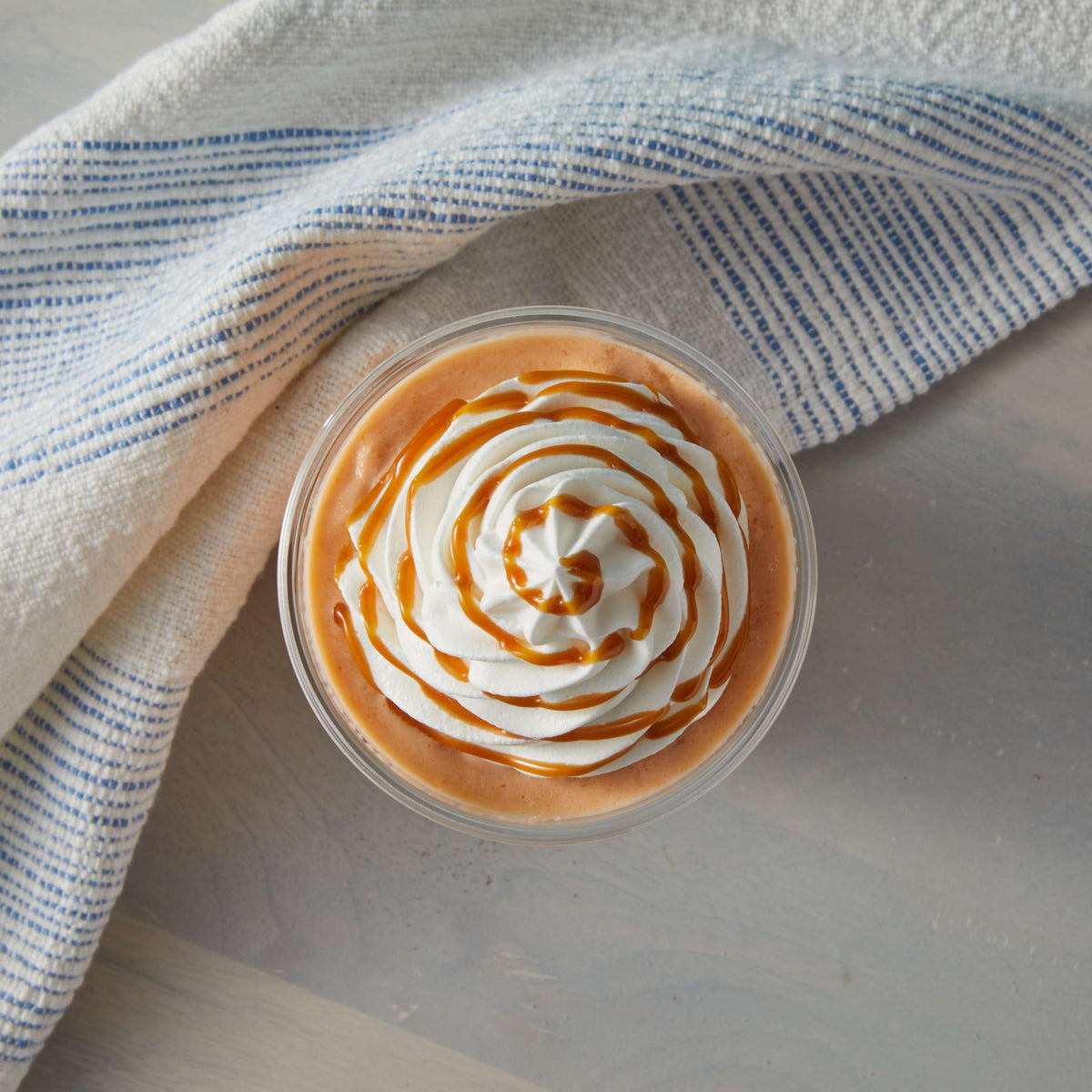 Big Train Dulce De Leche froth topping captures café-ready creamy finish.