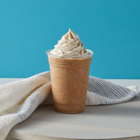 Big Train No Sugar Added Vanilla Chai Tea Latte Mix stirred with a spoon, ready for a comforting mug.
