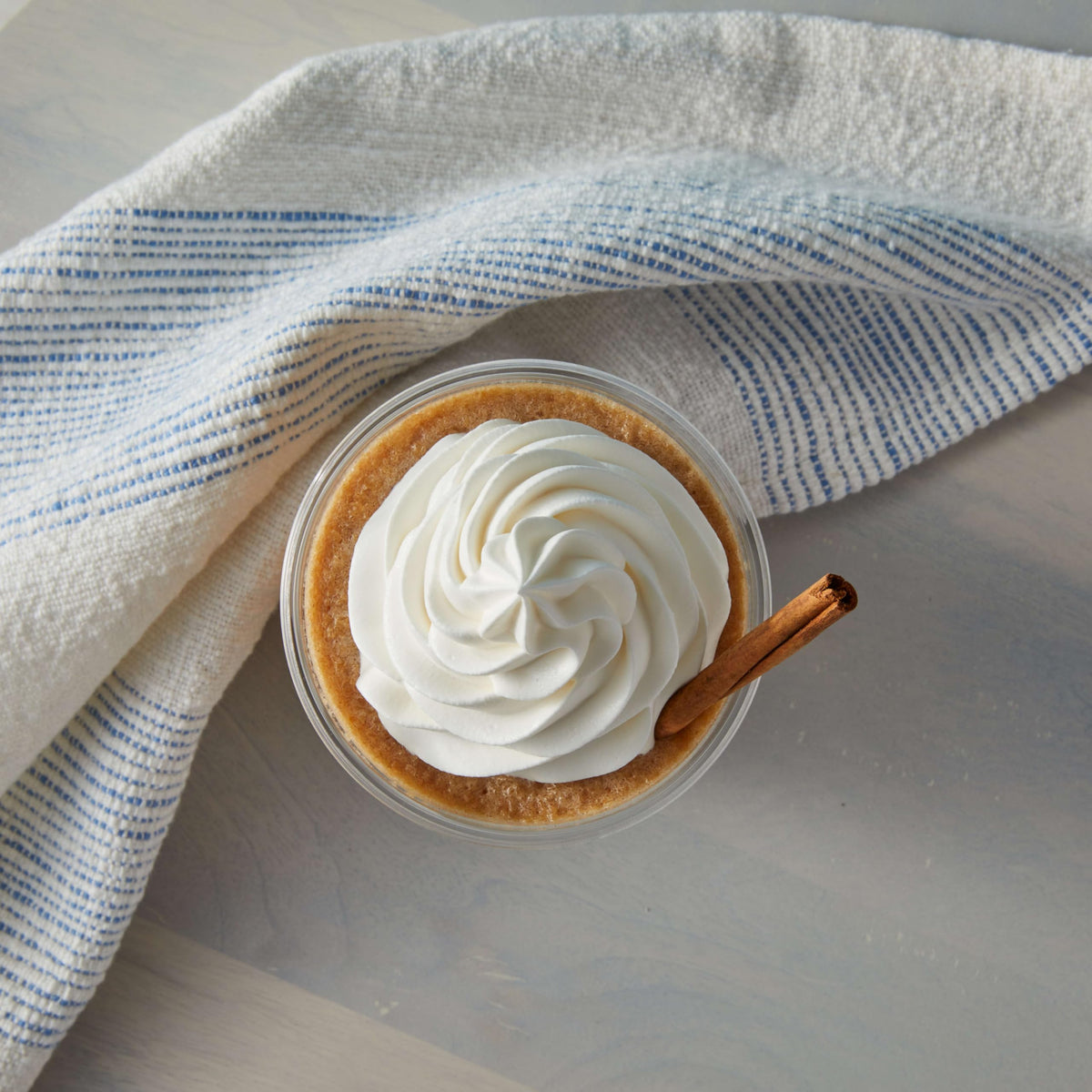 Big Train Spiced Chai Tea Latte Mix creamy foam topping on cup.