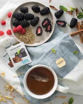 Bigelow Benefits Balance tea cup with steam highlights caffeine-free, soothing flavor.