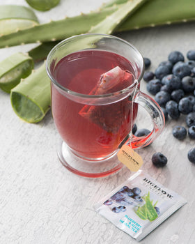 A steaming cup of Bigelow Benefits Blueberry & Aloe Tea