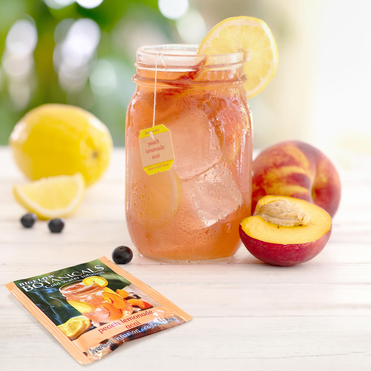Bigelow Peach Lemonade Acai infusion in a glass shows refreshing, caffeine-free flavor