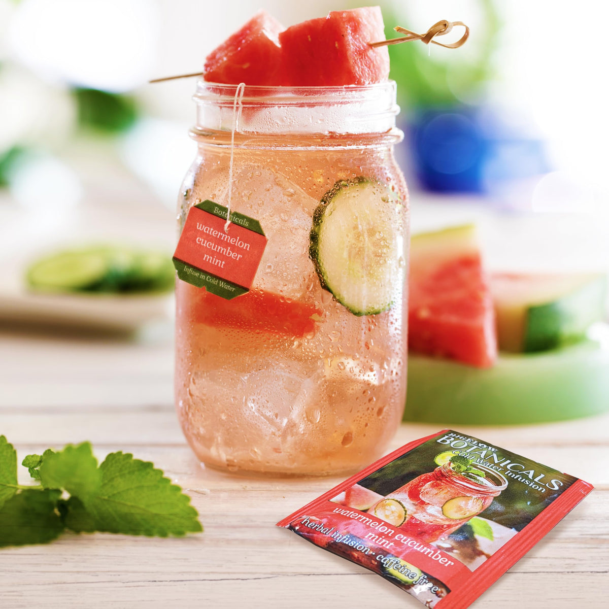 Glass of water infused with Bigelow Watermelon Cucumber Mint for caffeine-free refreshment.