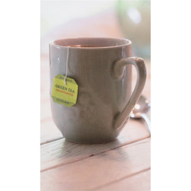 Bigelow Green Tea bags with a steaming cup highlighting smooth flavor for hot or iced tea.