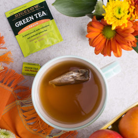 Bigelow Green Tea with Peach packaging highlighting freshness and portability