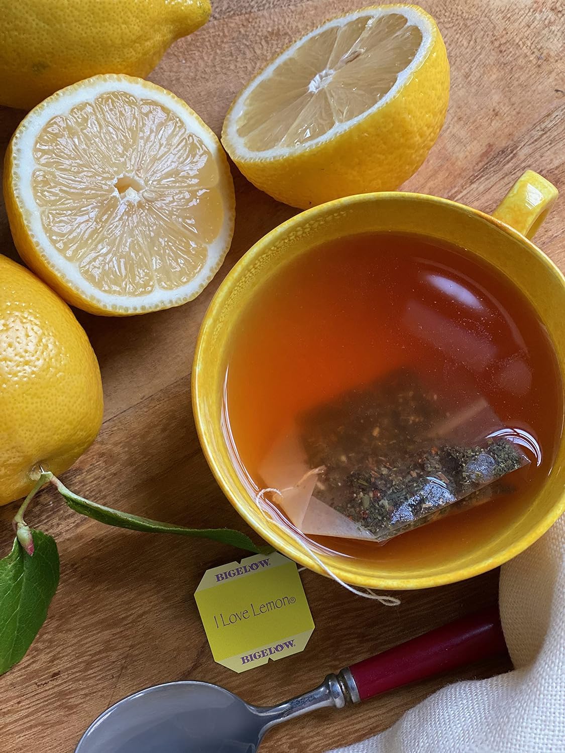 Bigelow lemon tea steeping cup, caffeine-free for a relaxing afternoon.