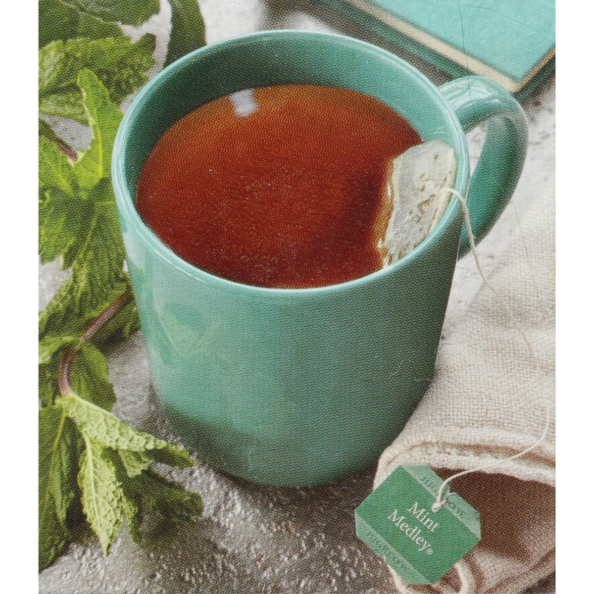 Closeup of Bigelow Mint Medley tea bags highlighting refreshing spearmint and peppermint blend.