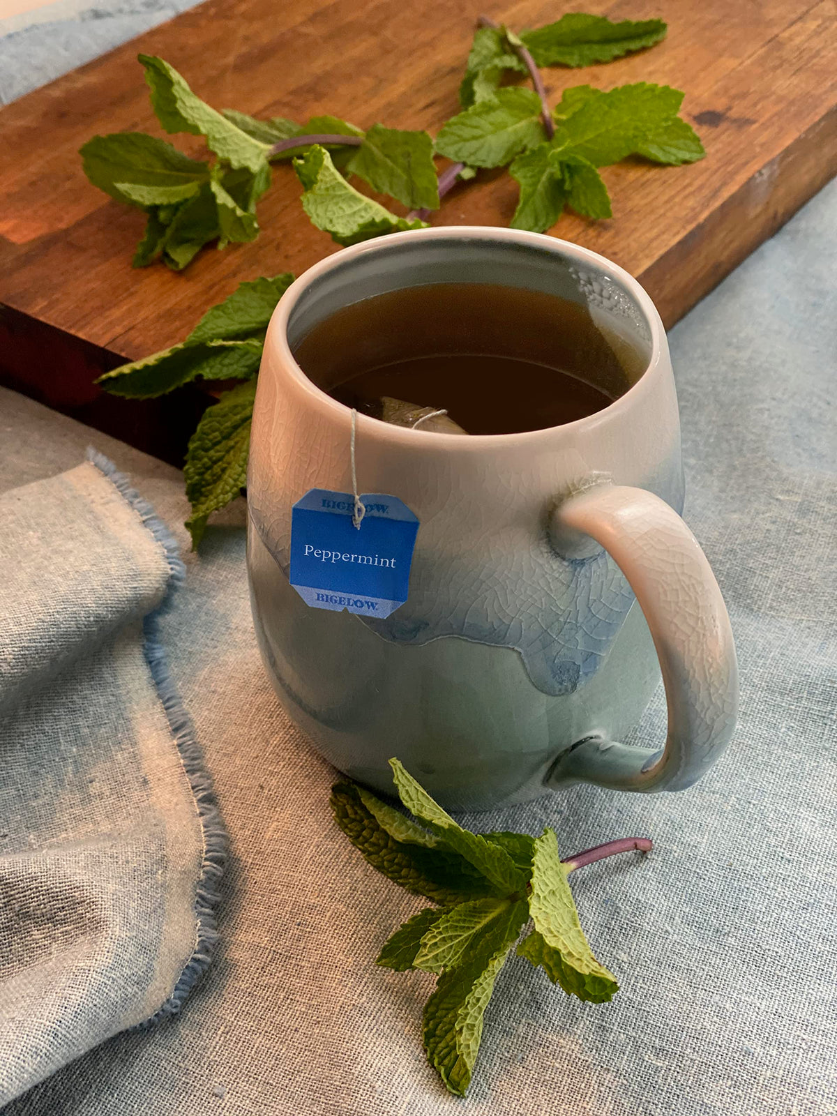 Bigelow peppermint tea bags steeping in cup highlighting refreshing aroma and smooth finish
