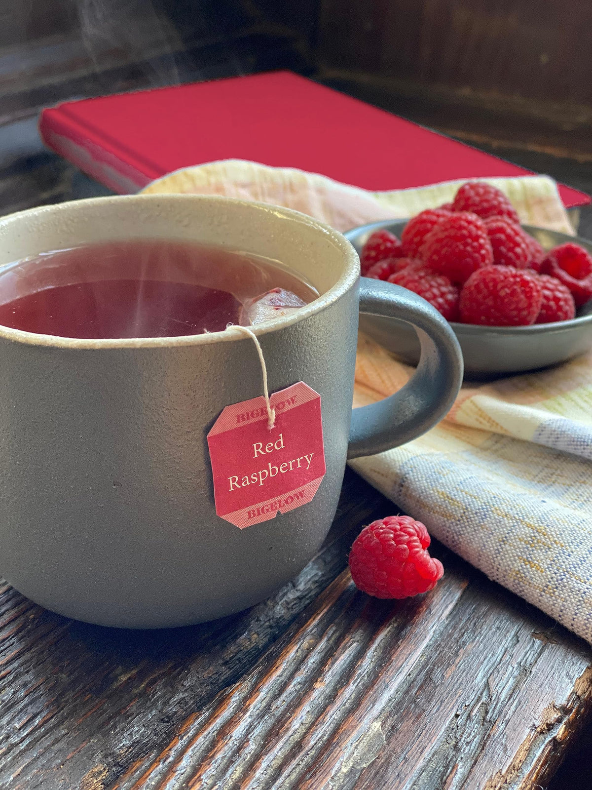 Bigelow Red Raspberry Tea cup showing vibrant brew and inviting fragrance.