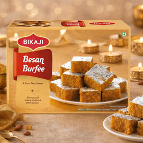 Bikaji Besan Burfi sliced piece on plate ready to serve as dessert.