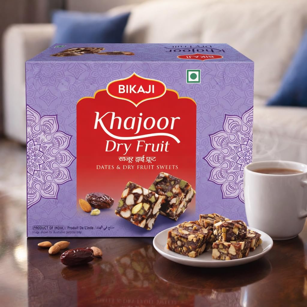 BIKAJI Khajoor Dry Fruit Burfi ingredients close-up featuring dates and nuts.