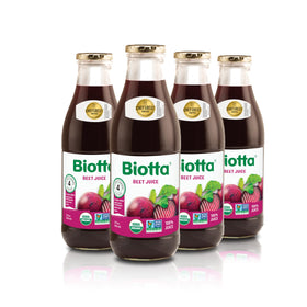 Biotta Beet Juice bottle on table, natural energy and refreshment possibility.