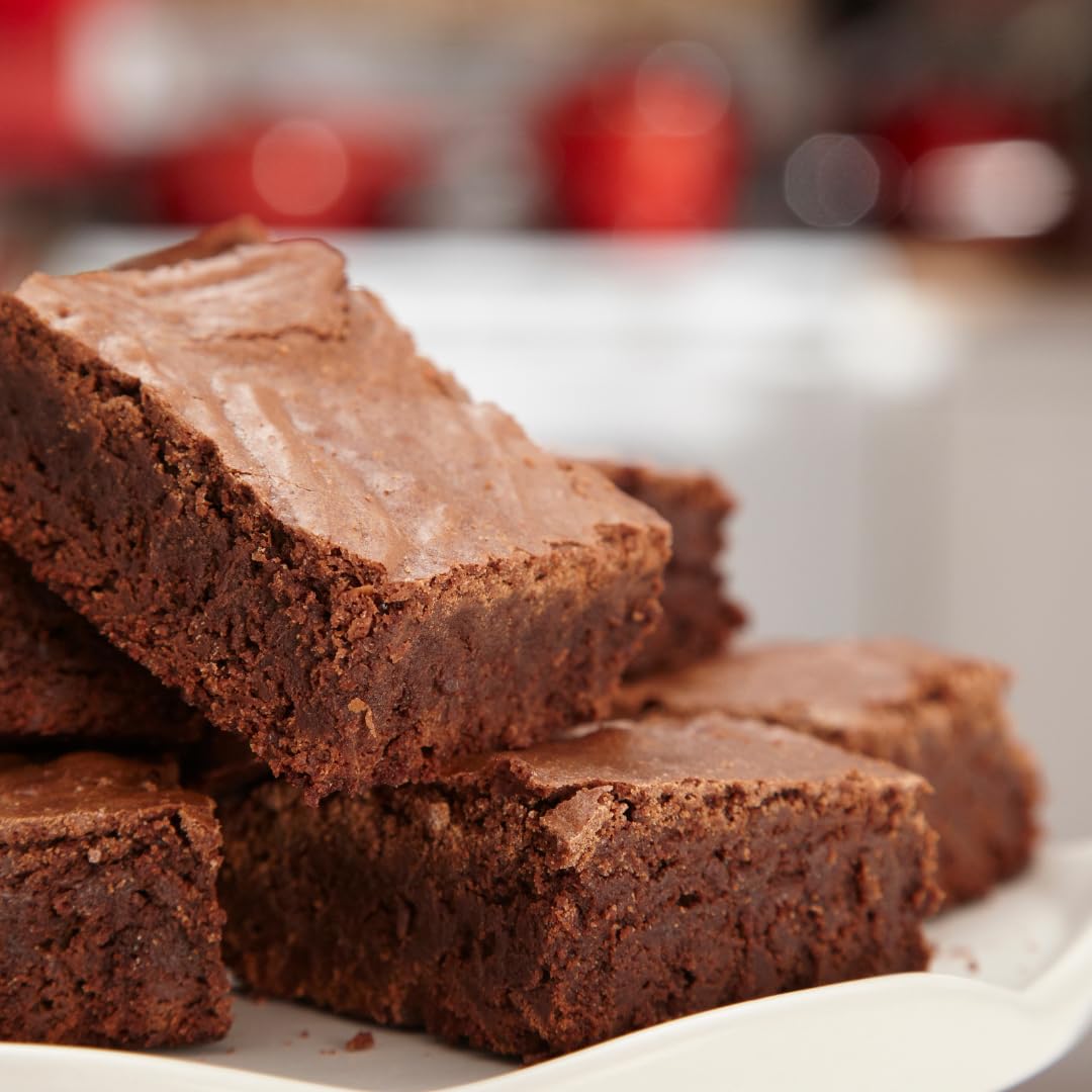 Birch & Meadow High Fat Dutch Cocoa Powder dusting on cakes for deep chocolate finish.