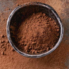 Birch & Meadow High Fat Dutch Cocoa Powder scoop ready for baking muffins and cookies.