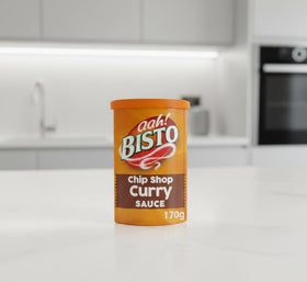 Bisto Chip Shop Curry Sauce Granules with chips, ideal for comforting chippy-night dinners.