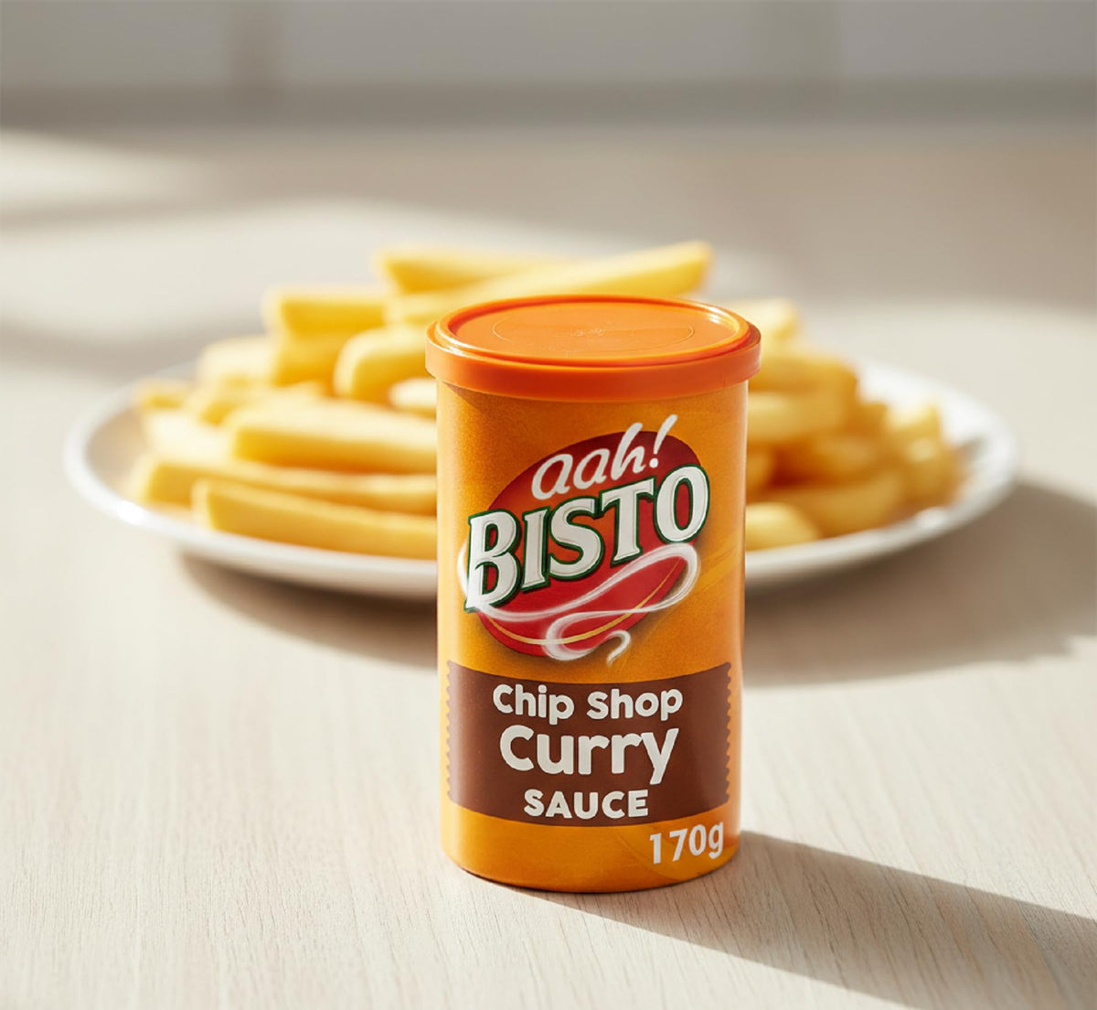 Bisto Chip Shop Curry Sauce Granules dissolving in hot water for easy curry sauce.